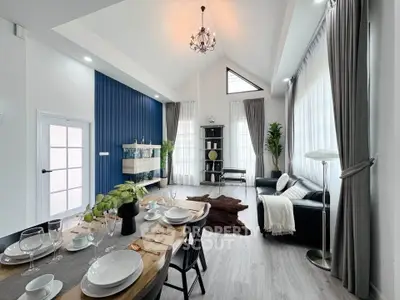 Spacious modern living room with high ceilings and elegant decor