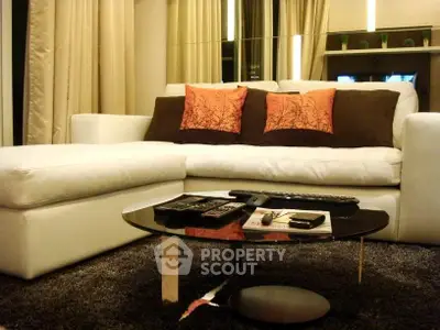 Stylish modern living room with white sectional sofa and chic decor