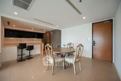 Spacious modern dining area with elegant furniture and open kitchen layout