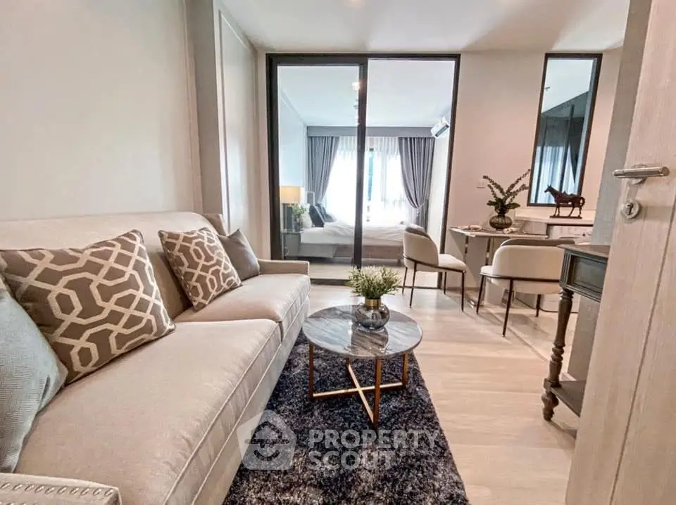 Stylish living room with modern decor and cozy seating area, perfect for relaxation.