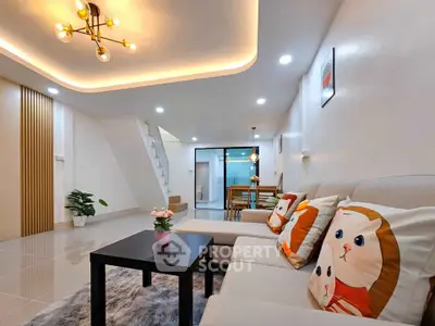 Stylish living room with modern lighting and cozy decor in a contemporary home.