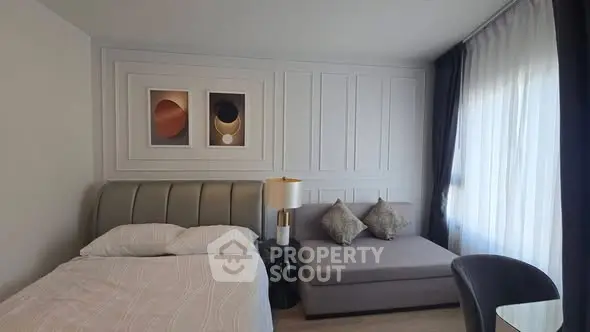 Modern bedroom with stylish decor and natural light