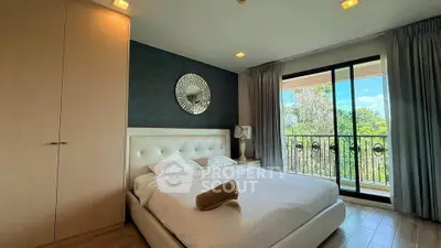 Luxurious bedroom with elegant decor and balcony view, perfect for serene living.