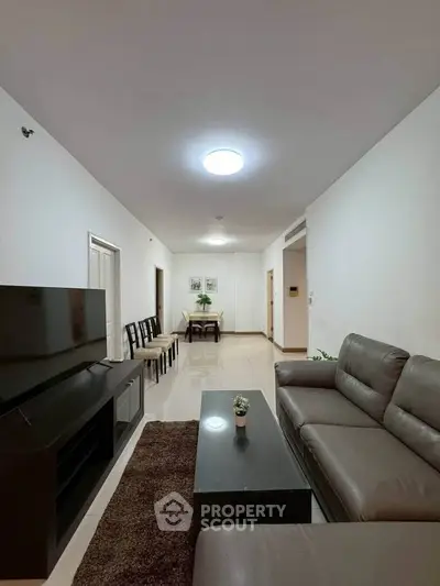 Spacious modern living room with sleek furniture and elegant decor