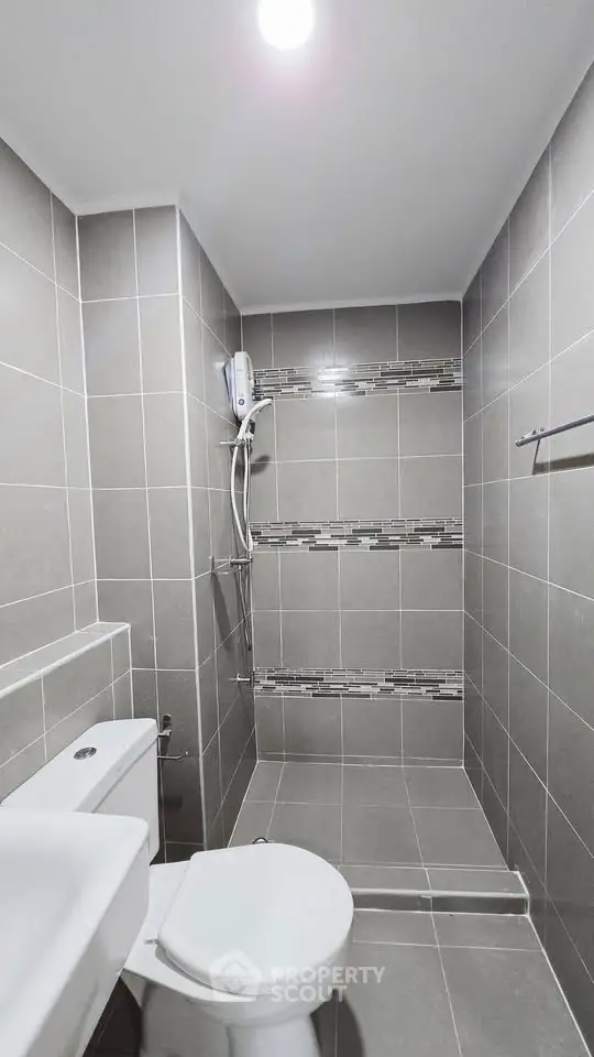 Modern bathroom with sleek gray tiles and contemporary fixtures