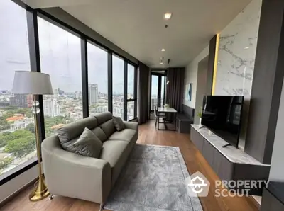 Luxurious corner unit living room with panoramic city views and modern decor