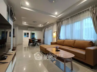 Spacious modern living room with elegant decor and ample natural light