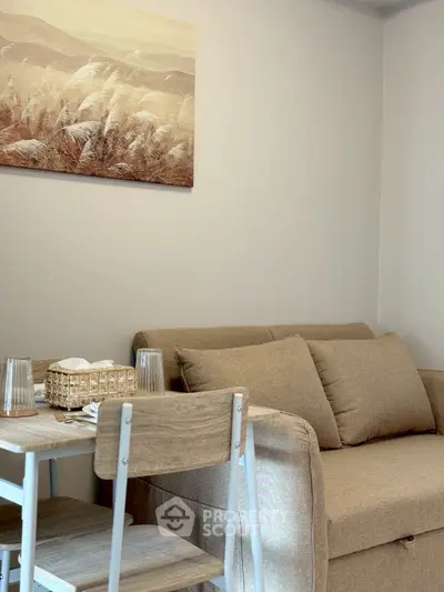 Cozy living room with beige sofa and modern decor