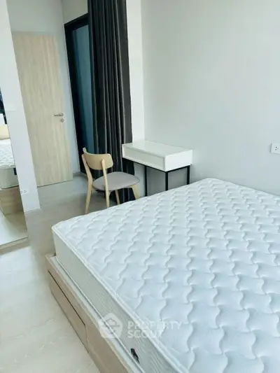 Modern minimalist bedroom with natural light and stylish furniture