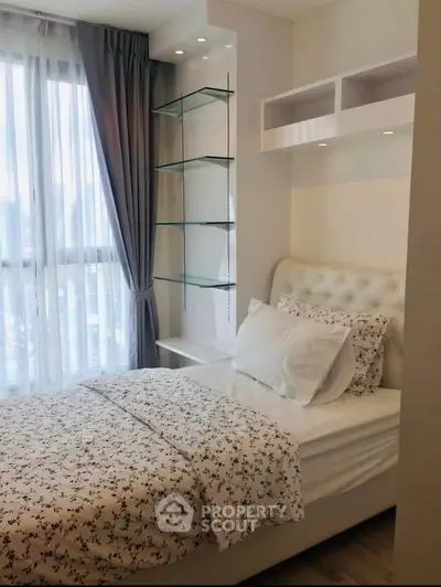 Cozy bedroom with elegant decor and city view through large windows