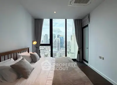 Luxurious bedroom with stunning city view and modern decor