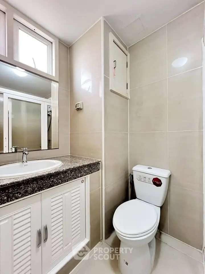 Modern bathroom with sleek design and elegant fixtures in a contemporary home.