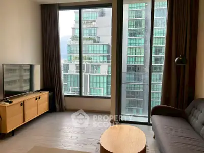 Modern living room with large windows and city view, featuring a sleek sofa and TV unit.