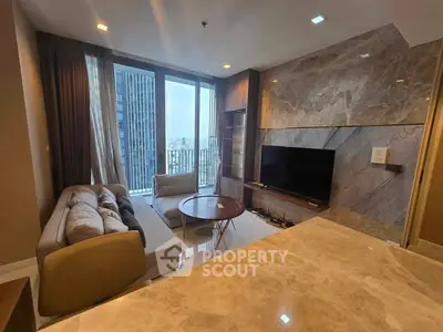 Modern living room with marble accents and city view balcony