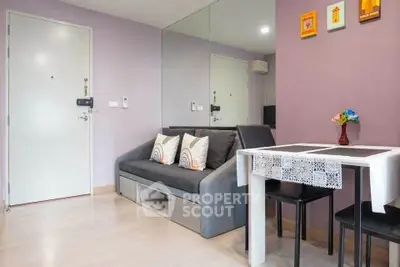 Modern living room with stylish decor and dining area in cozy apartment.