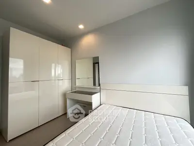 Modern bedroom with sleek wardrobe and minimalist design
