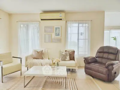 Elegant living room with cozy seating and natural light