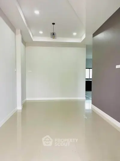 Spacious modern interior with sleek flooring and elegant lighting, perfect for customization.