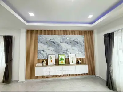 Modern living room with elegant wall decor and ambient lighting