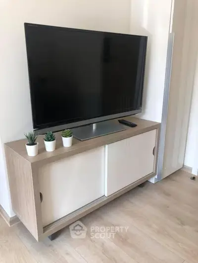 Modern living room with sleek TV stand and minimalist decor
