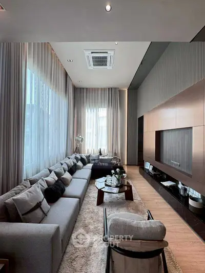 Luxurious modern living room with high ceilings and elegant decor