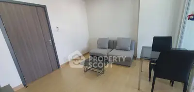 Modern minimalist living room with sleek furniture and wooden flooring