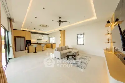 Spacious modern living room with open kitchen and sleek design