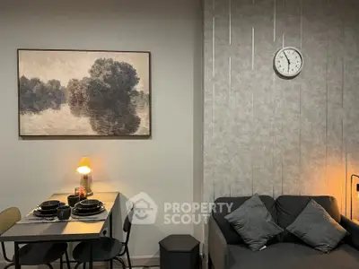 Stylish living room with modern decor, cozy sofa, and elegant dining area, perfect for urban living.