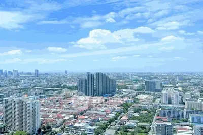 Stunning cityscape view showcasing modern high-rise buildings under a clear blue sky.