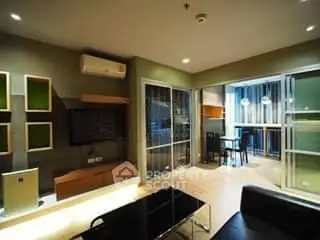 Modern living room with open layout and stylish decor, featuring a cozy seating area and contemporary lighting.