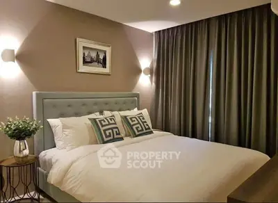 Elegant bedroom with plush bed, stylish decor, and soft lighting for a cozy ambiance.