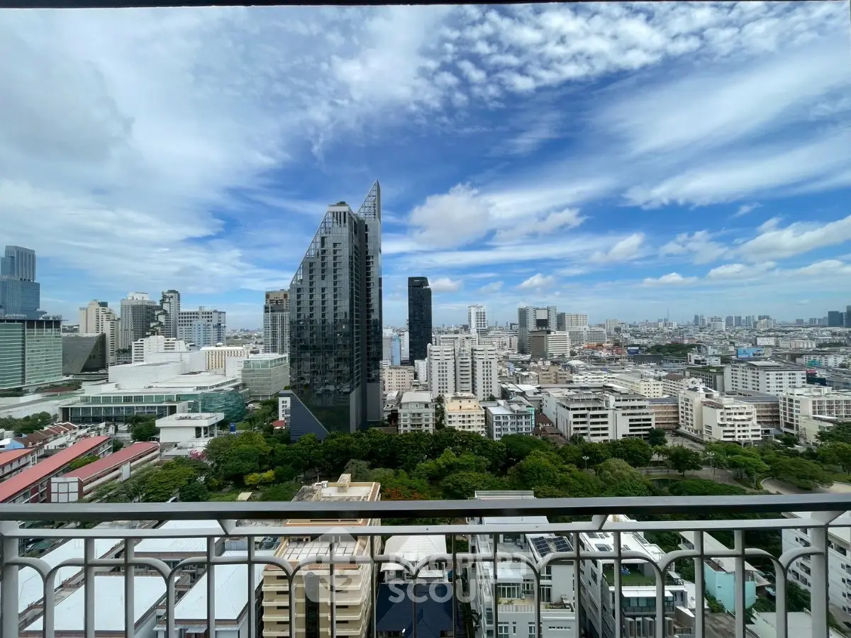 Stunning cityscape view from a high-rise balcony showcasing modern architecture and vibrant skyline.