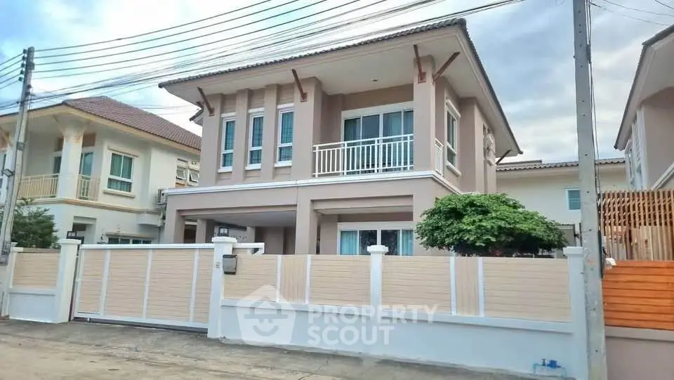 Charming two-story house with modern design and fenced yard in a serene neighborhood.