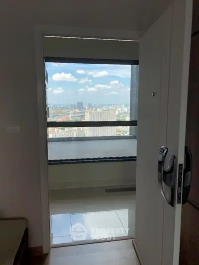 Stunning city view from modern apartment balcony with open door