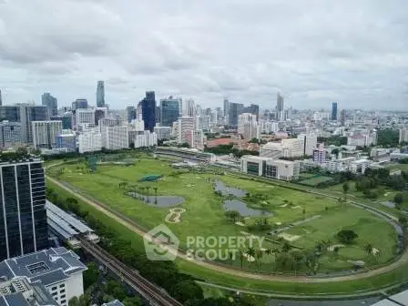 Stunning cityscape view with lush green golf course and modern skyline, perfect for urban living enthusiasts.