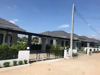 Charming suburban homes with modern design and lush greenery in a peaceful neighborhood.