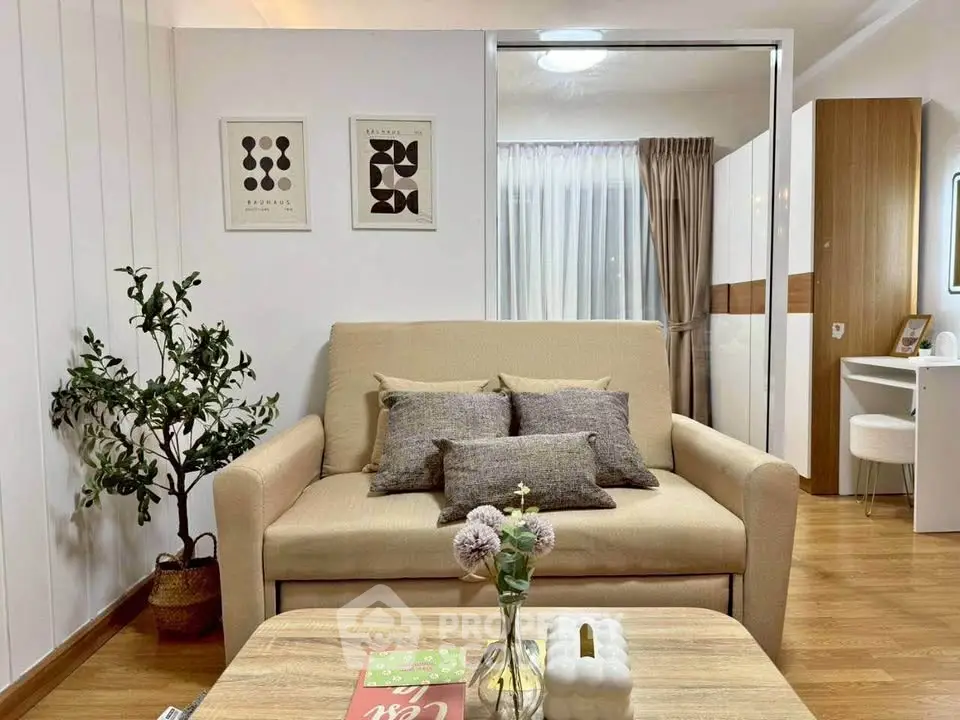 Cozy living room with beige sofa and modern decor in stylish apartment.