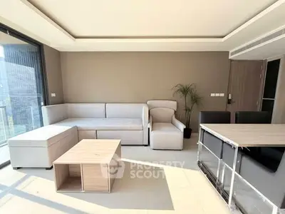 Modern living room with sleek furniture and abundant natural light