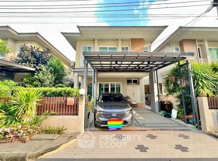 Charming modern house with carport and lush garden in a serene neighborhood.