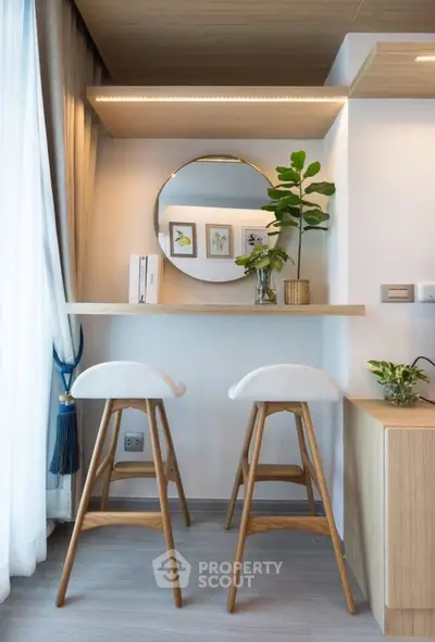 Stylish modern study nook with wooden bar stools and decorative plants