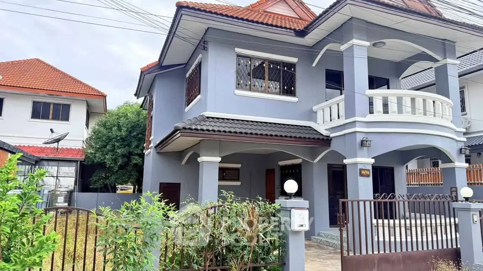 Charming two-story house with modern design and spacious balcony in a serene neighborhood.