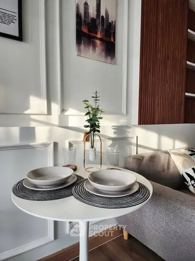 Stylish modern living room with elegant decor and cozy seating area.