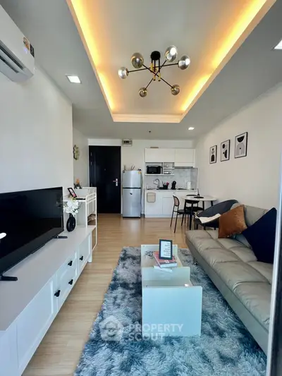 Modern living room with stylish decor and open kitchen layout