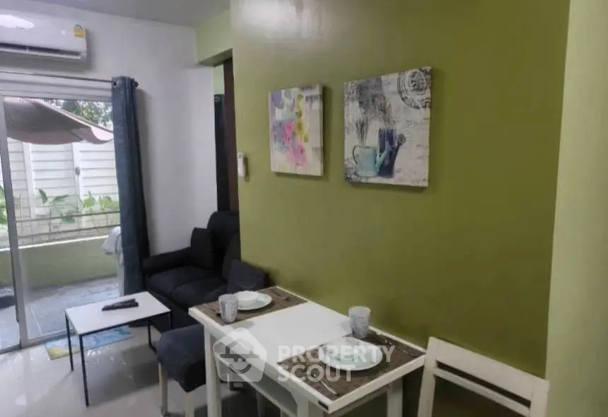 Cozy living room with dining area and outdoor view, perfect for modern living.