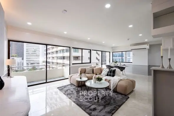 Spacious modern living room with large windows and city view