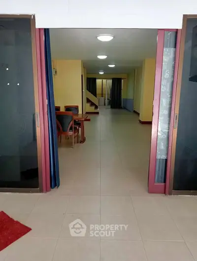 Spacious open-plan interior with modern dining area and ample natural light.