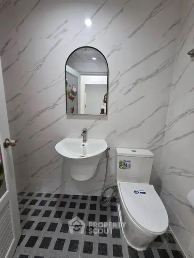 Modern bathroom with sleek fixtures and stylish tile design