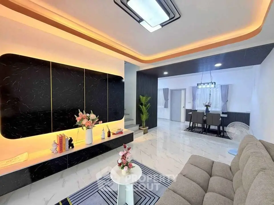 Modern living room with stylish lighting and elegant dining area