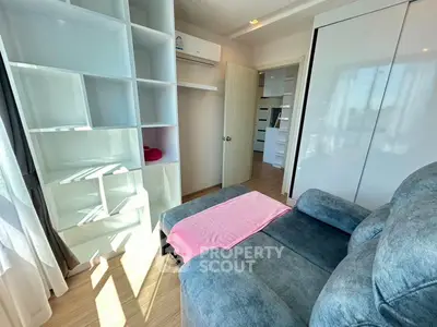 Bright and cozy living room with modern shelving and comfortable seating