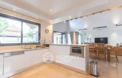 Spacious open-layout kitchen and living area with modern appliances and ample natural light.